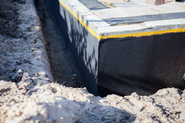 Professional Exterior Waterproofing technician working in Napoleon, MI